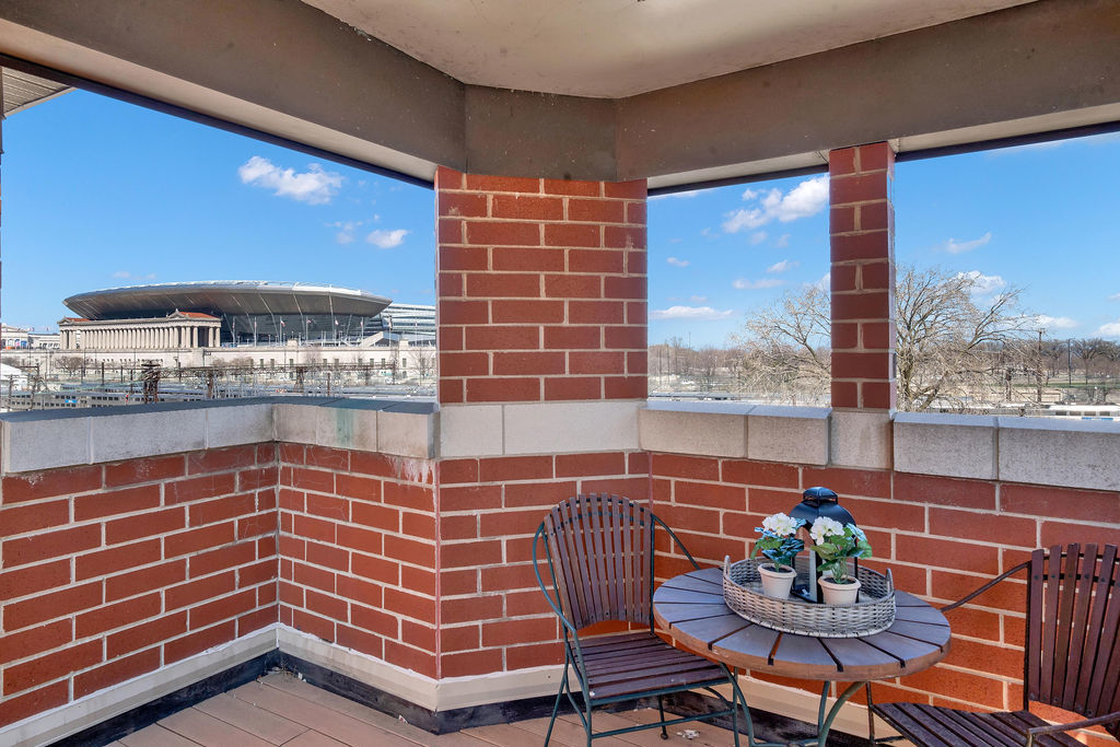 324 East 17th Street Chicago, IL 60616 - Photo 25 of 25 a dining room with furniture and a floor to ceiling window