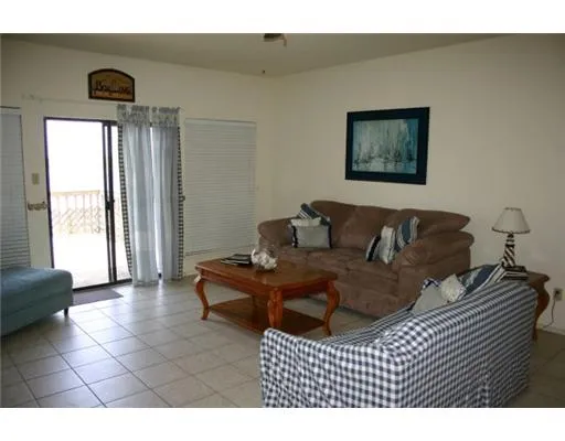 a living room with a couch and a large window