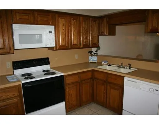 a kitchen with a sink and a stove