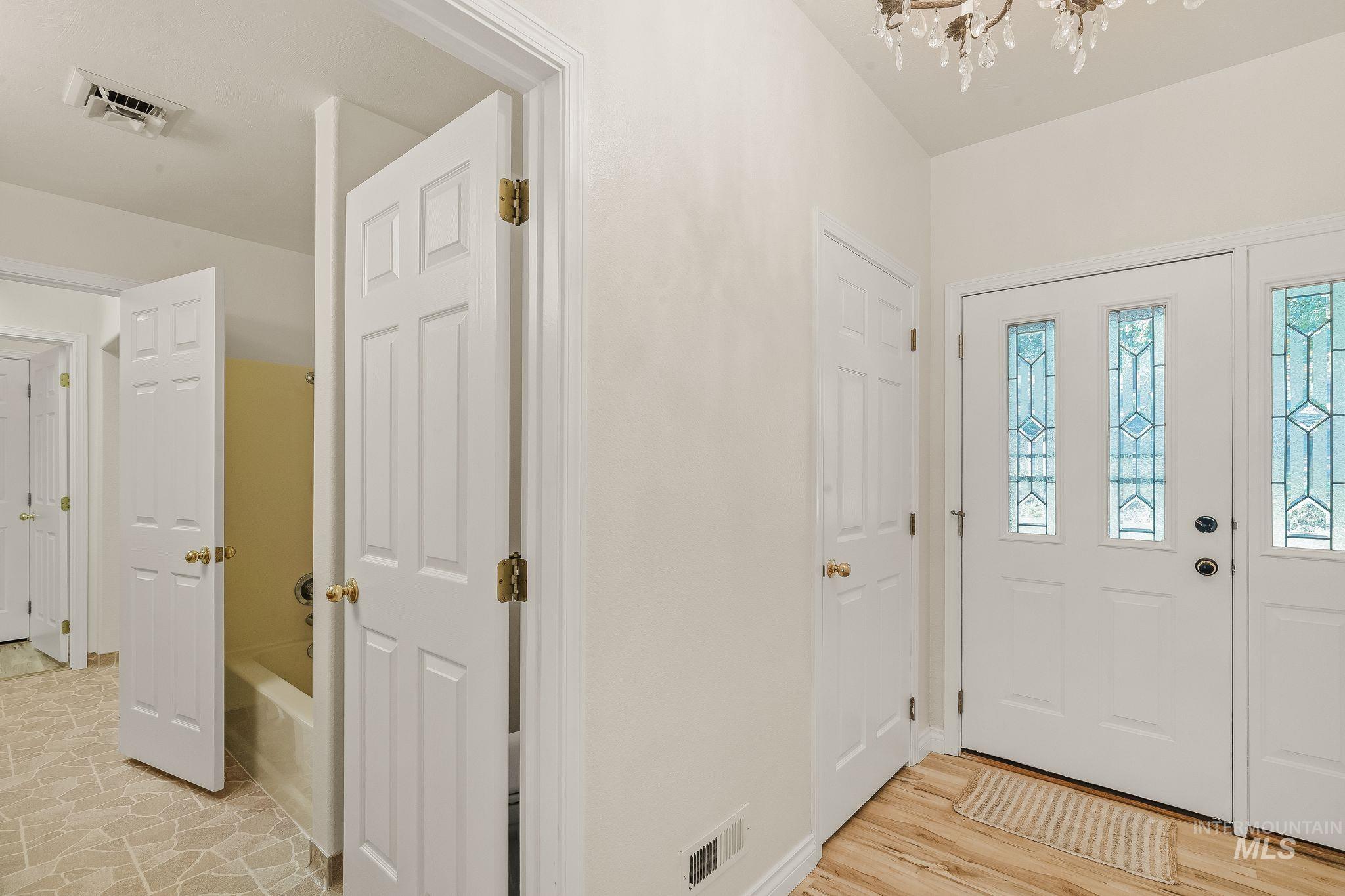 1091 Cedar Ridge Road Kendrick, ID 83537 - Photo 21 of 48 Entryway featuring a decorative transom window and wood-finish flooring