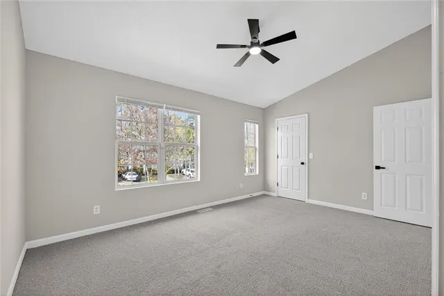 a view of an empty room with a window
