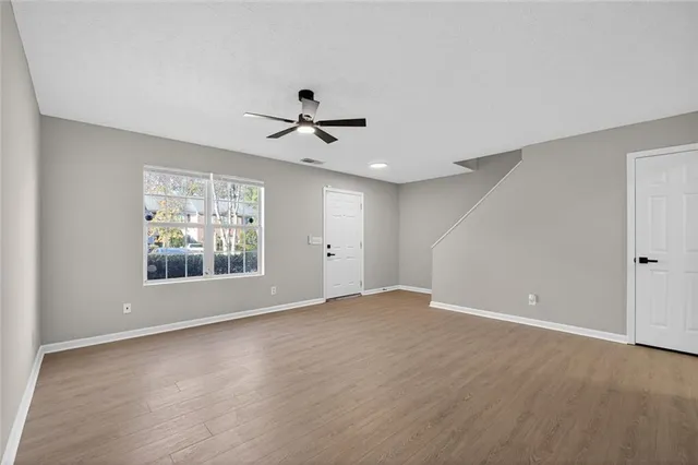 a view of room with hardwood floor and window