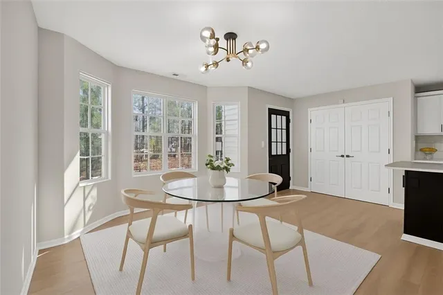 a dining room with furniture and window
