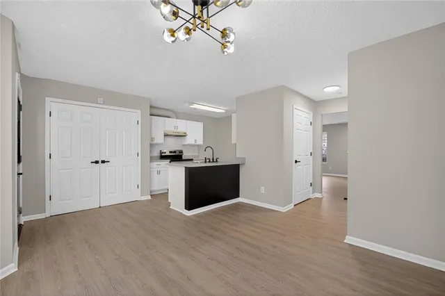a view of kitchen with wooden floor