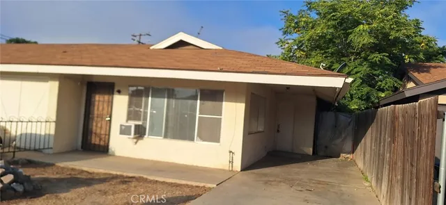 a front view of a house with a outdoor space