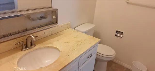 a bathroom with a sink and toilet