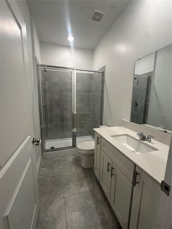 1623 Marksman Road Eagle Lake, FL 33839 - Photo 13 of 24 a bathroom with a granite countertop sink toilet and shower