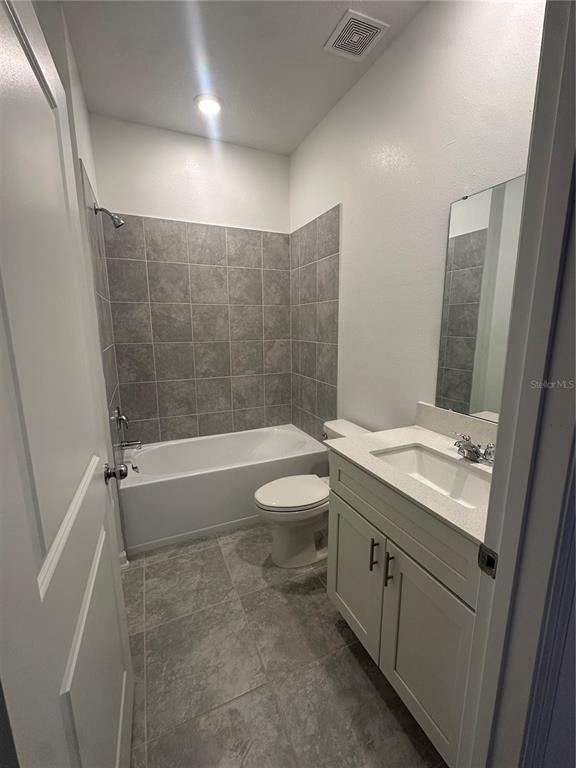 1623 Marksman Road Eagle Lake, FL 33839 - Photo 16 of 24 a bathroom with a granite countertop sink toilet and shower