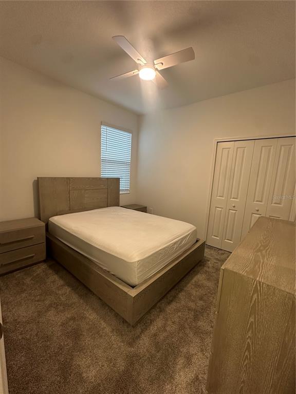 1623 Marksman Road Eagle Lake, FL 33839 - Photo 21 of 24 a bedroom with a bed and a ceiling fan