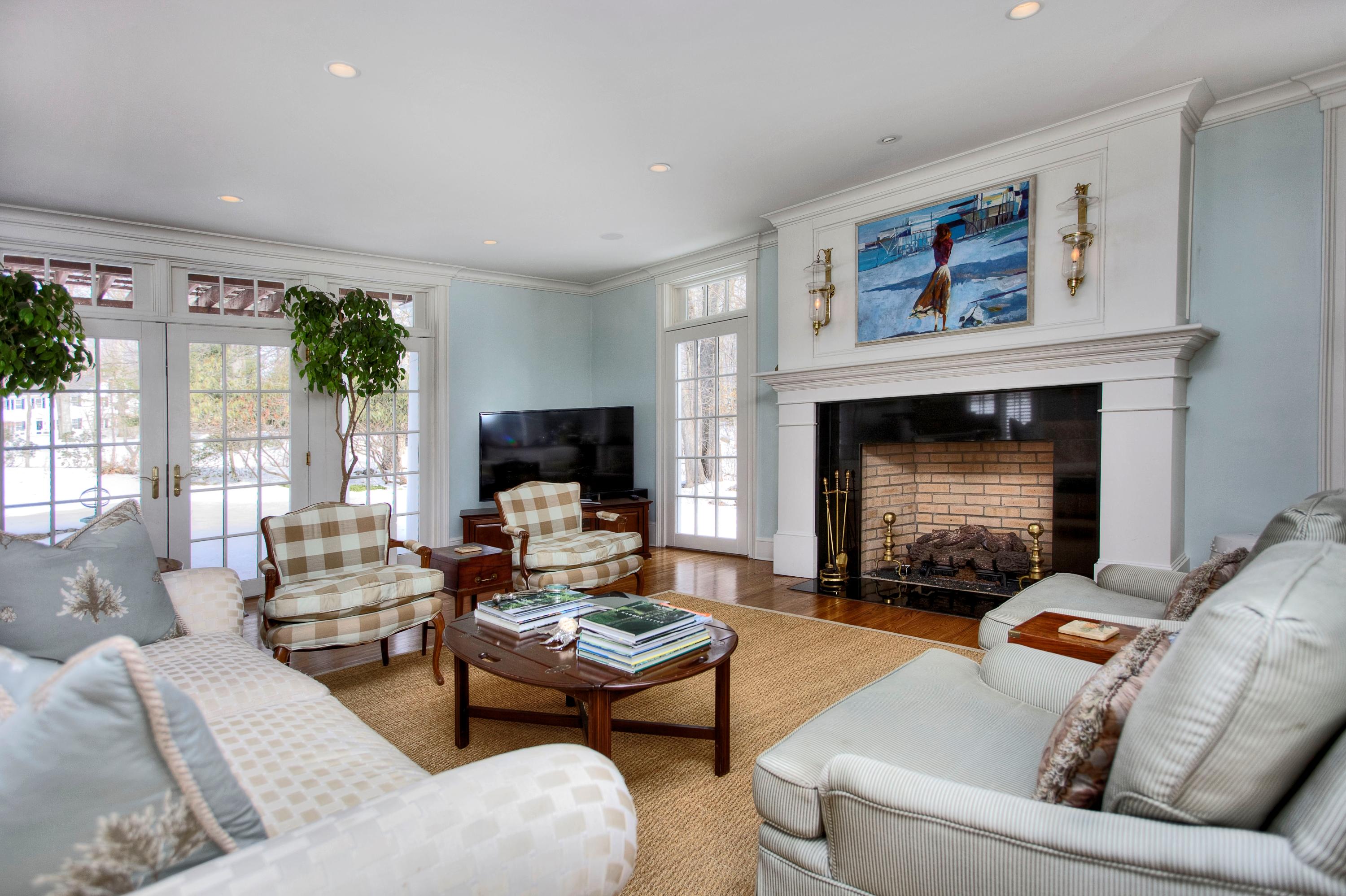 95 Pembroke Road Darien, CT 06820 - Photo 5 of 24 a living room with furniture a window and a fireplace