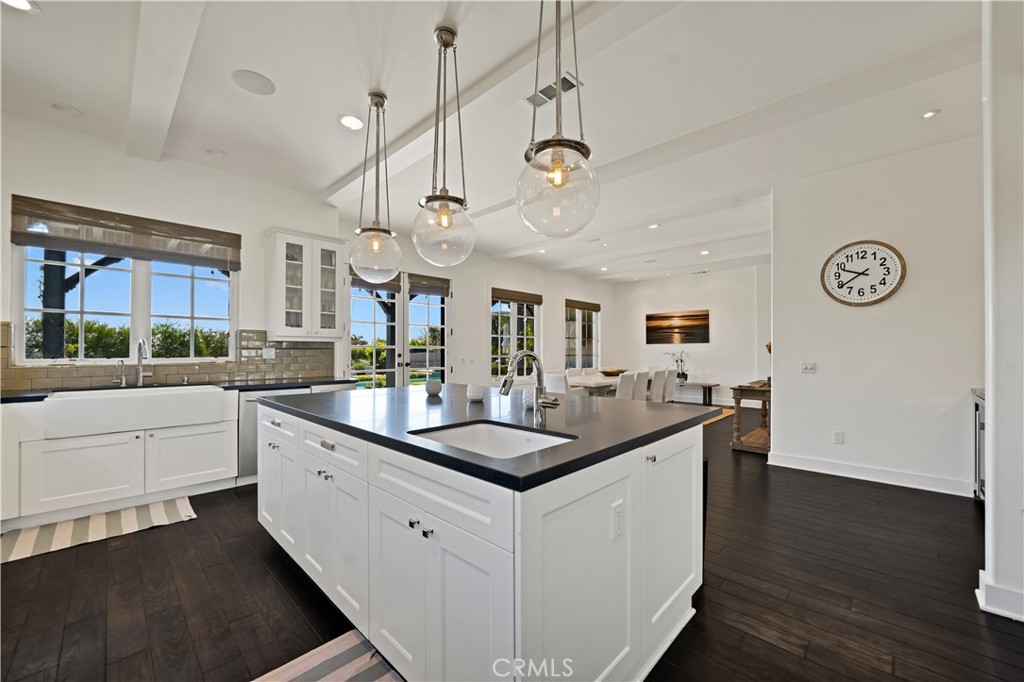 28850 Hampton Place Malibu, CA 90265 - Photo 14 of 53 a kitchen with granite countertop a sink a counter space and stainless steel appliances