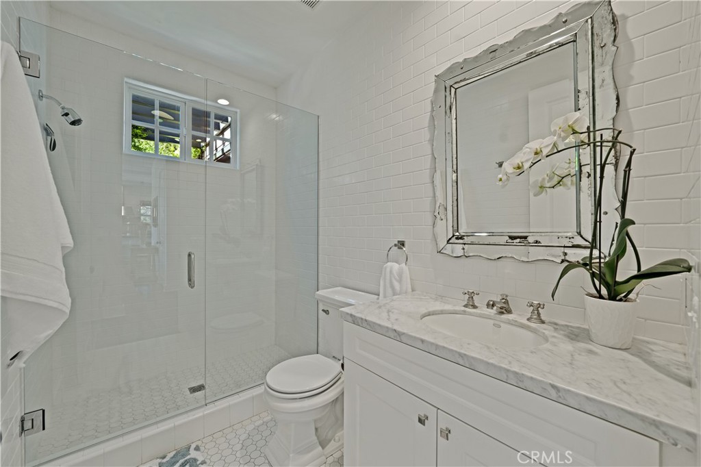 28850 Hampton Place Malibu, CA 90265 - Photo 16 of 53 a bathroom with a sink a toilet and shower