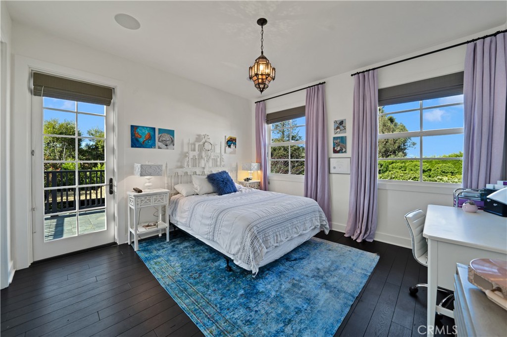 28850 Hampton Place Malibu, CA 90265 - Photo 22 of 53 a bedroom with a bed window and a table