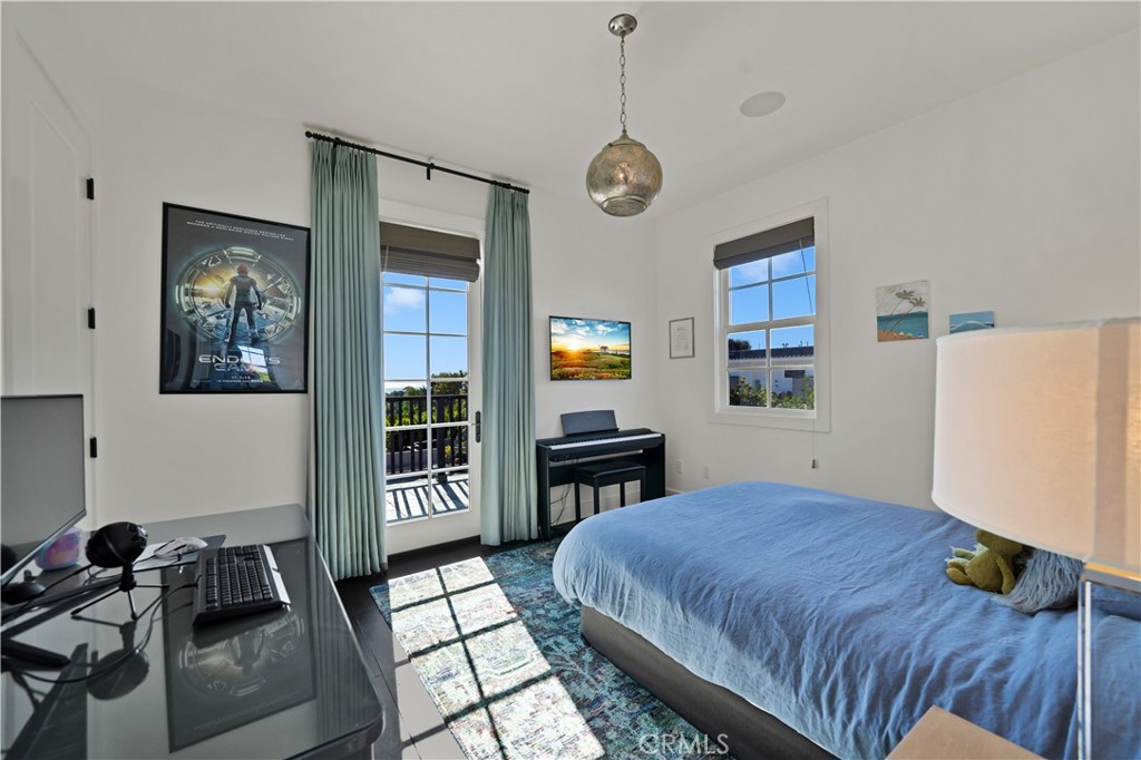 28850 Hampton Place Malibu, CA 90265 - Photo 24 of 53 a bed room with a bed and a chandelier