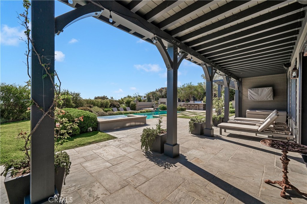 28850 Hampton Place Malibu, CA 90265 - Photo 26 of 53 a roof deck with table and chairs and potted plants