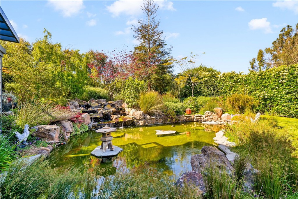 28850 Hampton Place Malibu, CA 90265 - Photo 27 of 53 a view of swimming pool with lawn chairs and plants