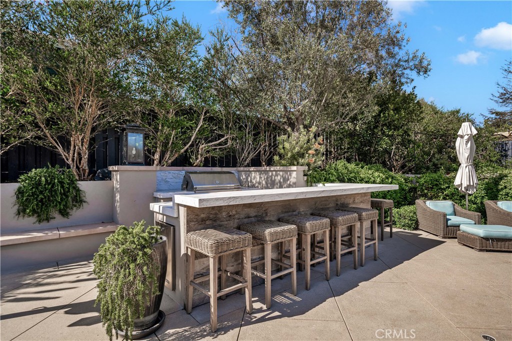 28850 Hampton Place Malibu, CA 90265 - Photo 31 of 53 a view of a chairs and table in the patio