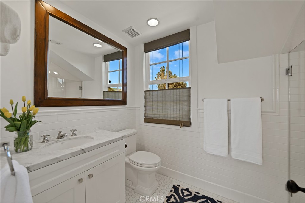 28850 Hampton Place Malibu, CA 90265 - Photo 36 of 53 a bathroom with a toilet sink and mirror