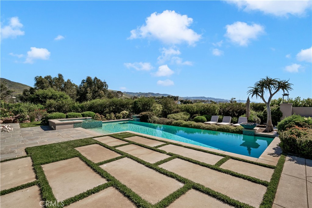 28850 Hampton Place Malibu, CA 90265 - Photo 38 of 53 a view of swimming pool with seating area and trees in the background