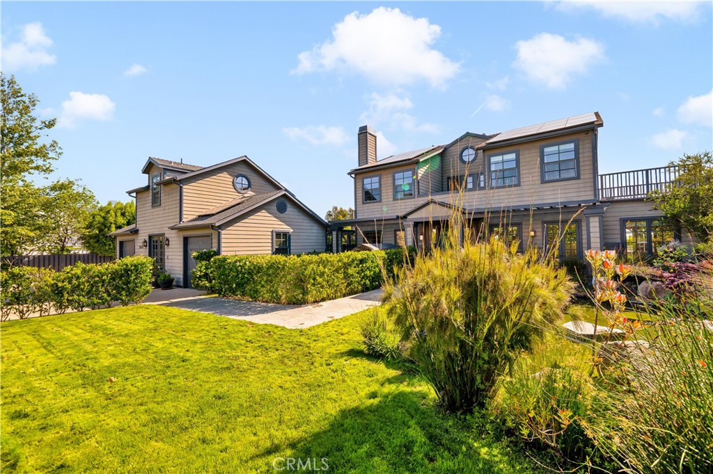28850 Hampton Place Malibu, CA 90265 - Photo 4 of 53 a view of a brick house with a big yard and large trees