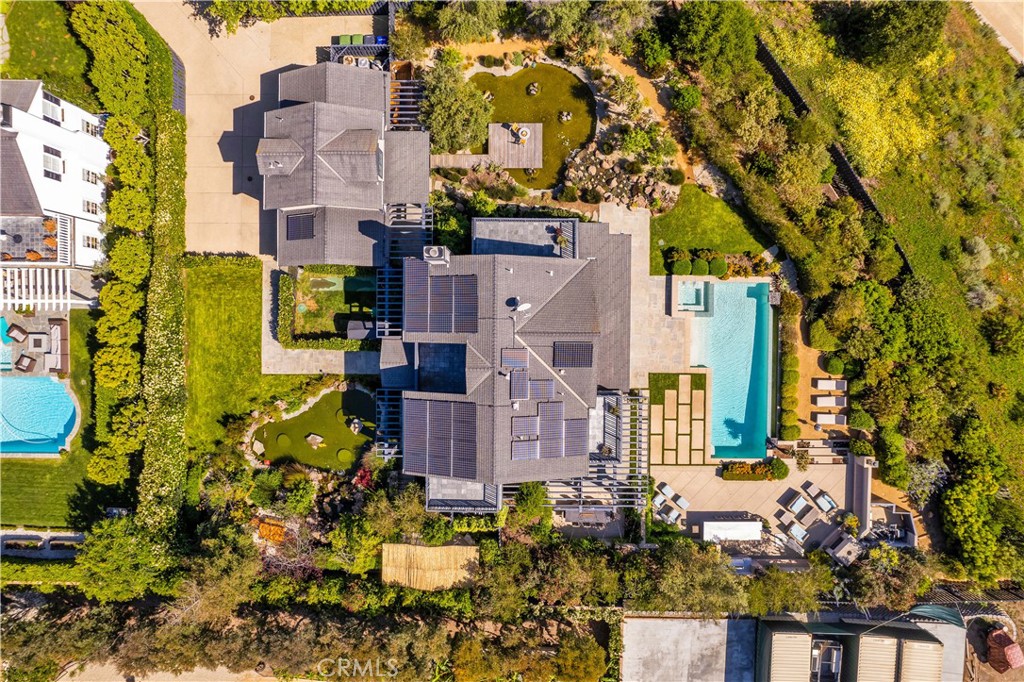 28850 Hampton Place Malibu, CA 90265 - Photo 53 of 53 front view of a house with a yard and fountain in middle
