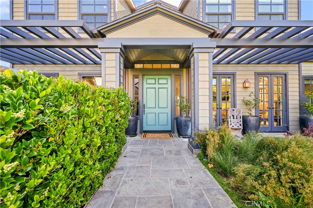 28850 Hampton Place Malibu, CA 90265 - Photo 6 of 53 a view of a house with potted plants next to a yard