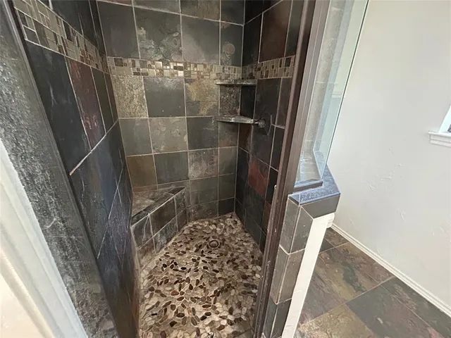 a bathroom with a sink and shower