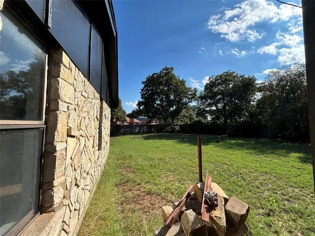 a backyard of a house with lots of green space
