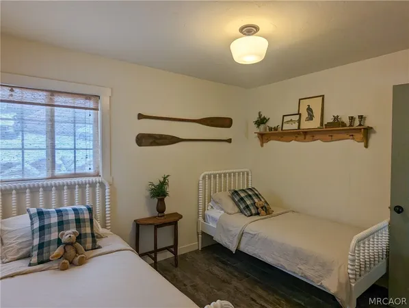 a bedroom with a bed and window