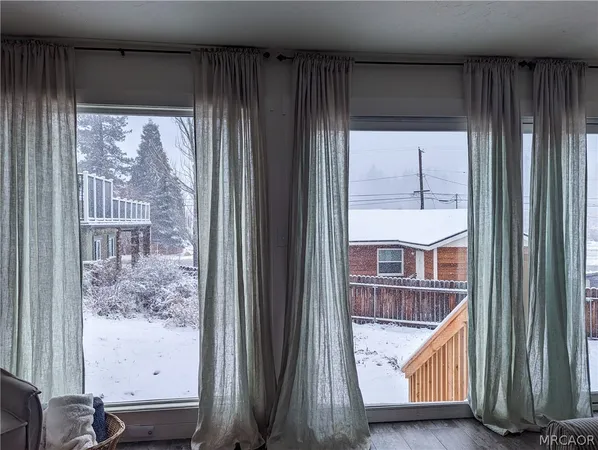 a view of balcony with wooden floor