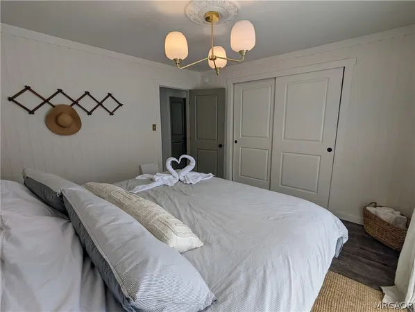 a bedroom with a bed and cabinets