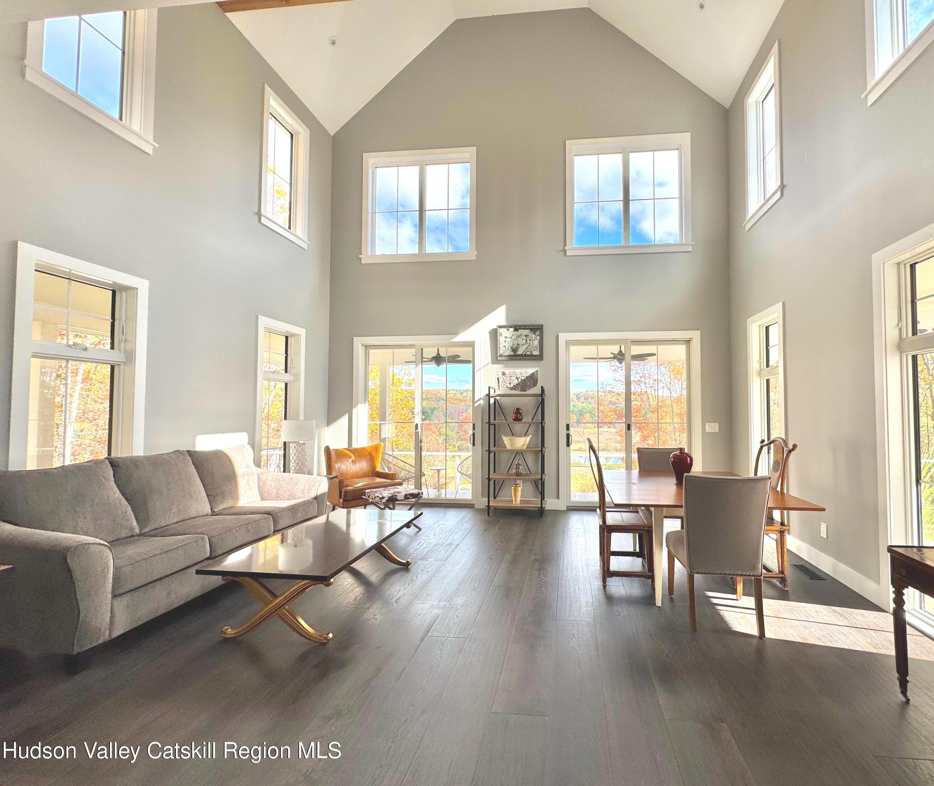 720 Sunny Hill Road Greenville, NY 12083 - Photo 11 of 44 a living room with furniture and wooden floor
