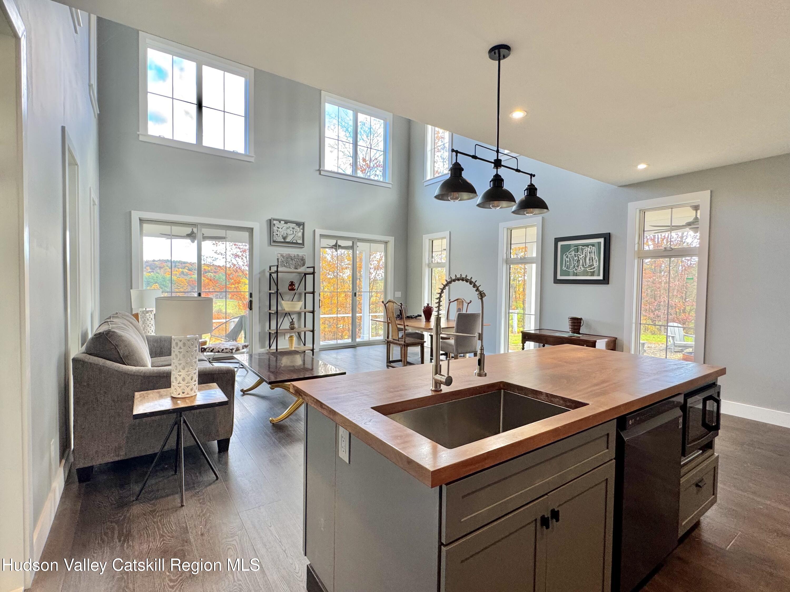 720 Sunny Hill Road Greenville, NY 12083 - Photo 13 of 42 a kitchen island with furniture and windows
