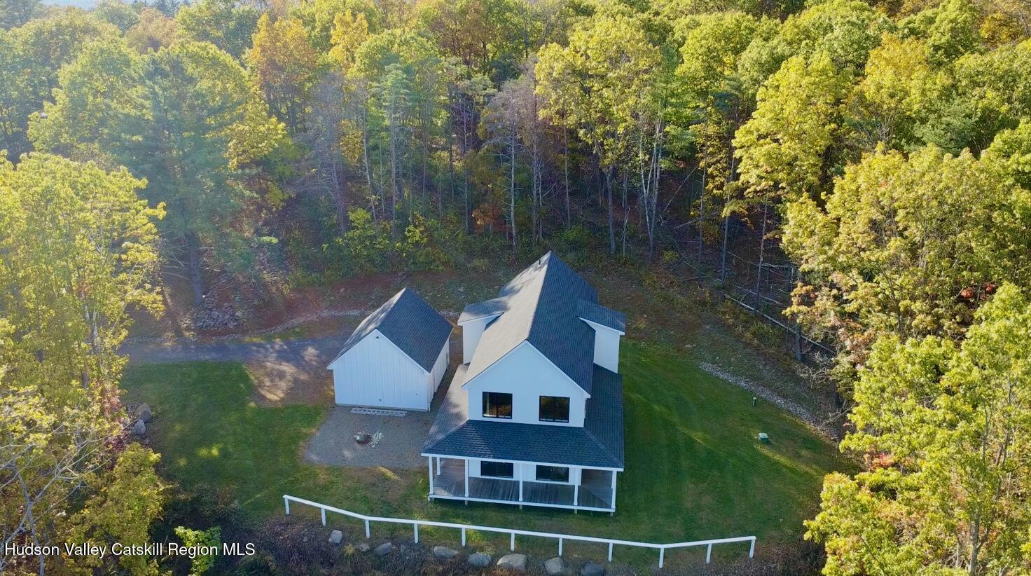 720 Sunny Hill Road Greenville, NY 12083 - Photo 2 of 42 a view of a big yard next to a house