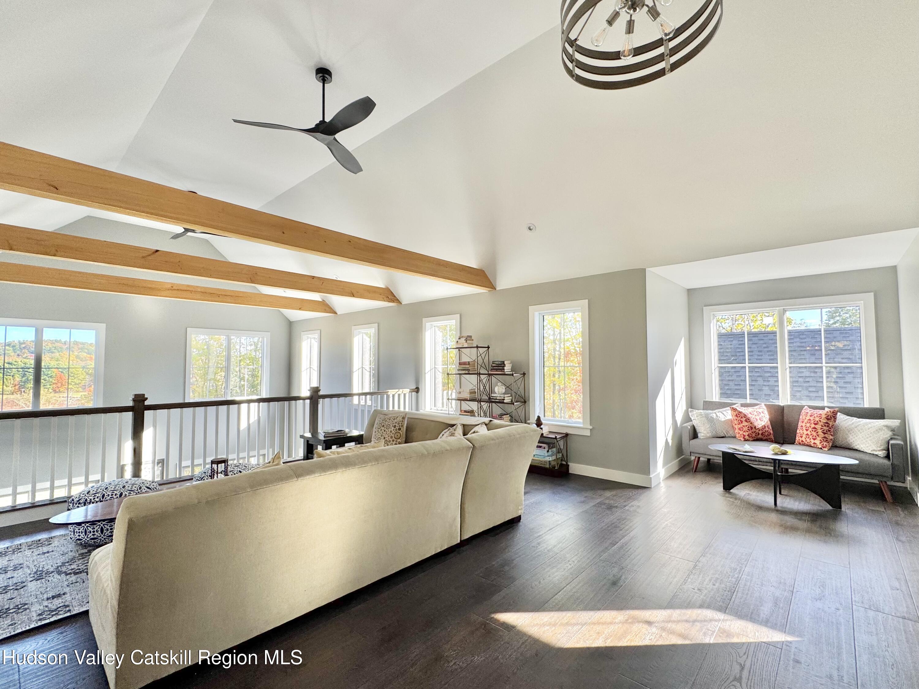 720 Sunny Hill Road Greenville, NY 12083 - Photo 21 of 44 a living room with furniture and a large window