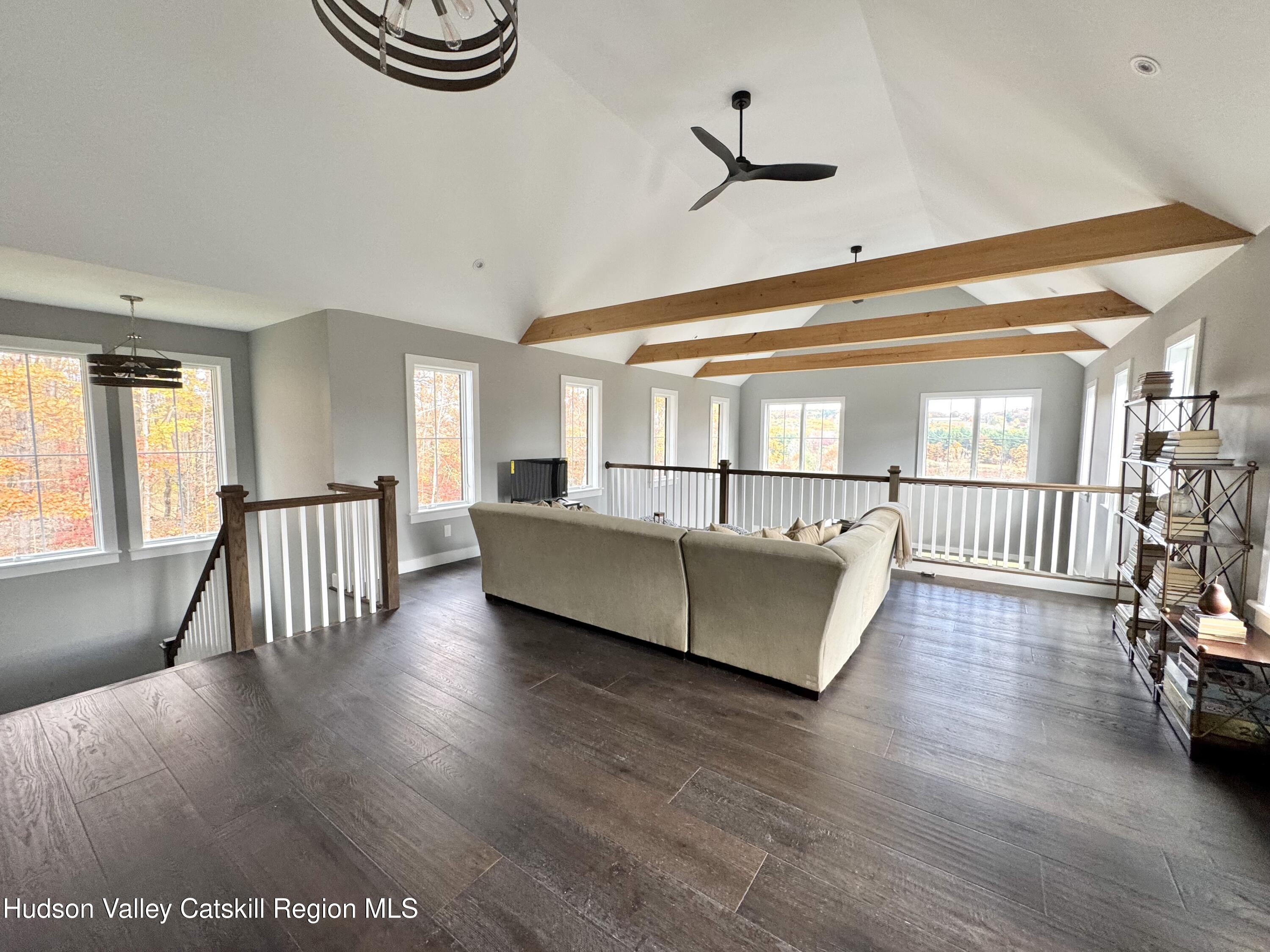 720 Sunny Hill Road Greenville, NY 12083 - Photo 22 of 42 a living room with furniture and a wooden floor