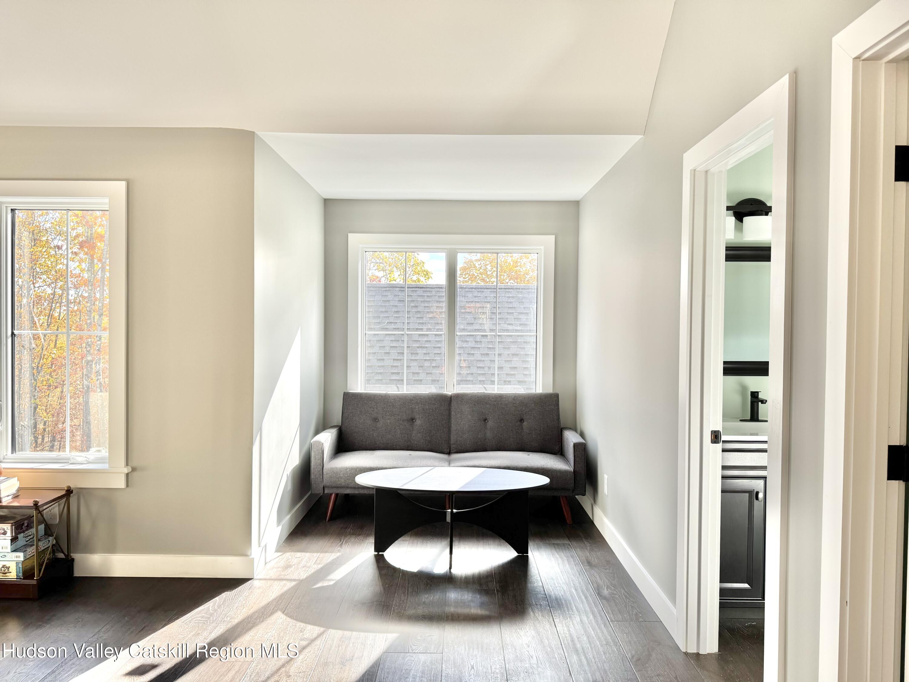 720 Sunny Hill Road Greenville, NY 12083 - Photo 23 of 42 a living room with a couch and a table