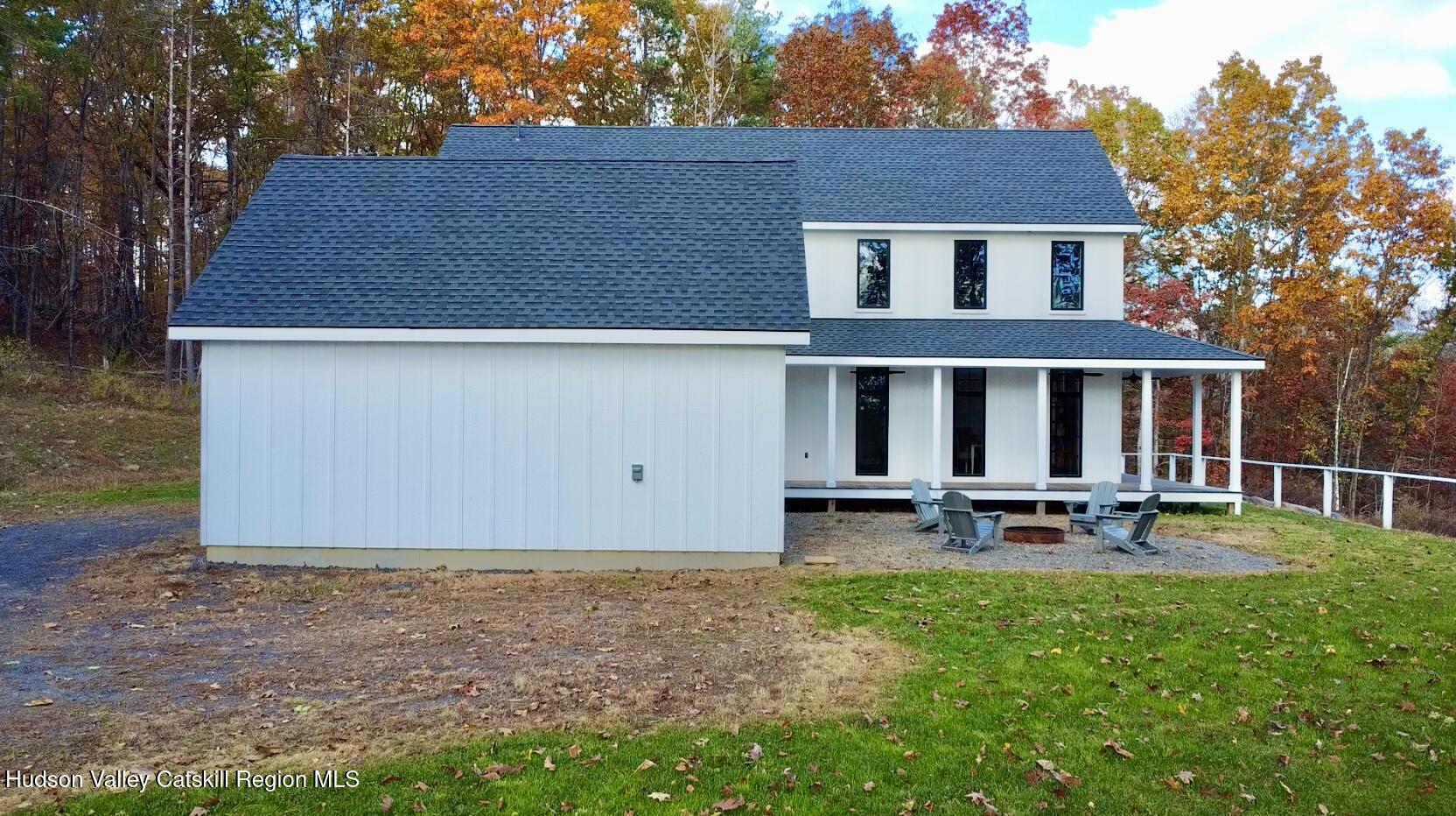 720 Sunny Hill Road Greenville, NY 12083 - Photo 34 of 44 a backyard of a house with table and chairs