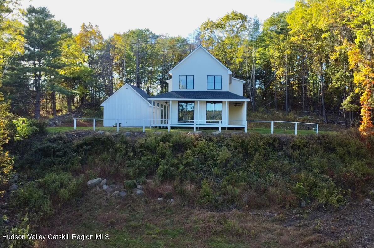 720 Sunny Hill Road Greenville, NY 12083 - Photo 37 of 42 a front view of a house with a yard