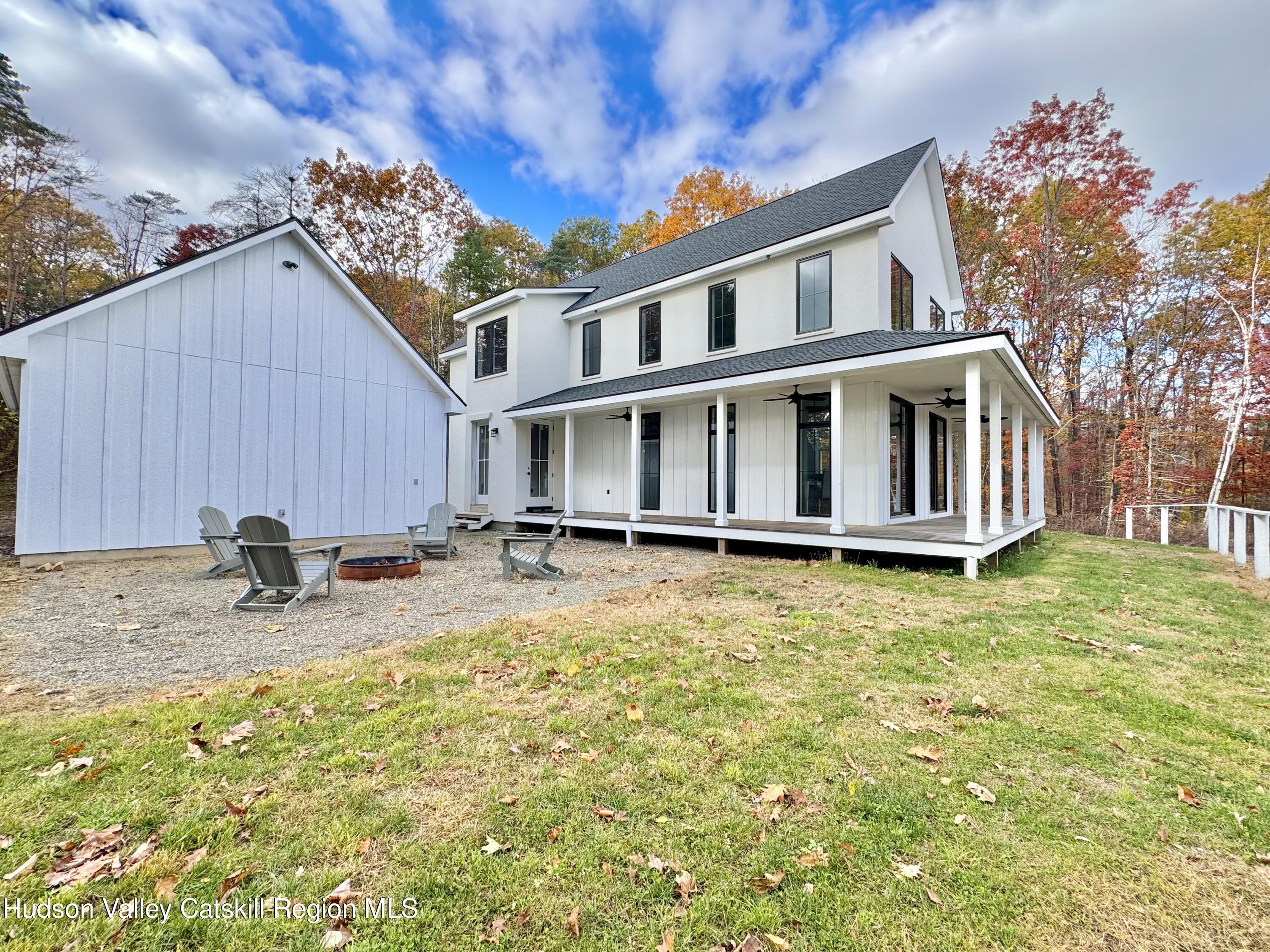 720 Sunny Hill Road Greenville, NY 12083 - Photo 6 of 42 a backyard of a house with table and chairs