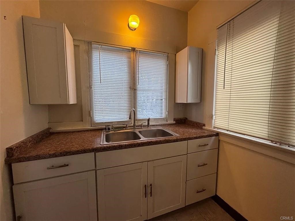 2726 5th Street, Unit 2 Riverside, CA 92507 - Photo 6 of 12 a kitchen with a sink and cabinets