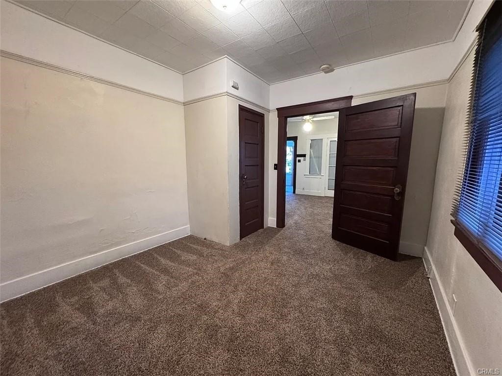 2726 5th Street, Unit 2 Riverside, CA 92507 - Photo 9 of 12 a view of an empty room with furniture and closet