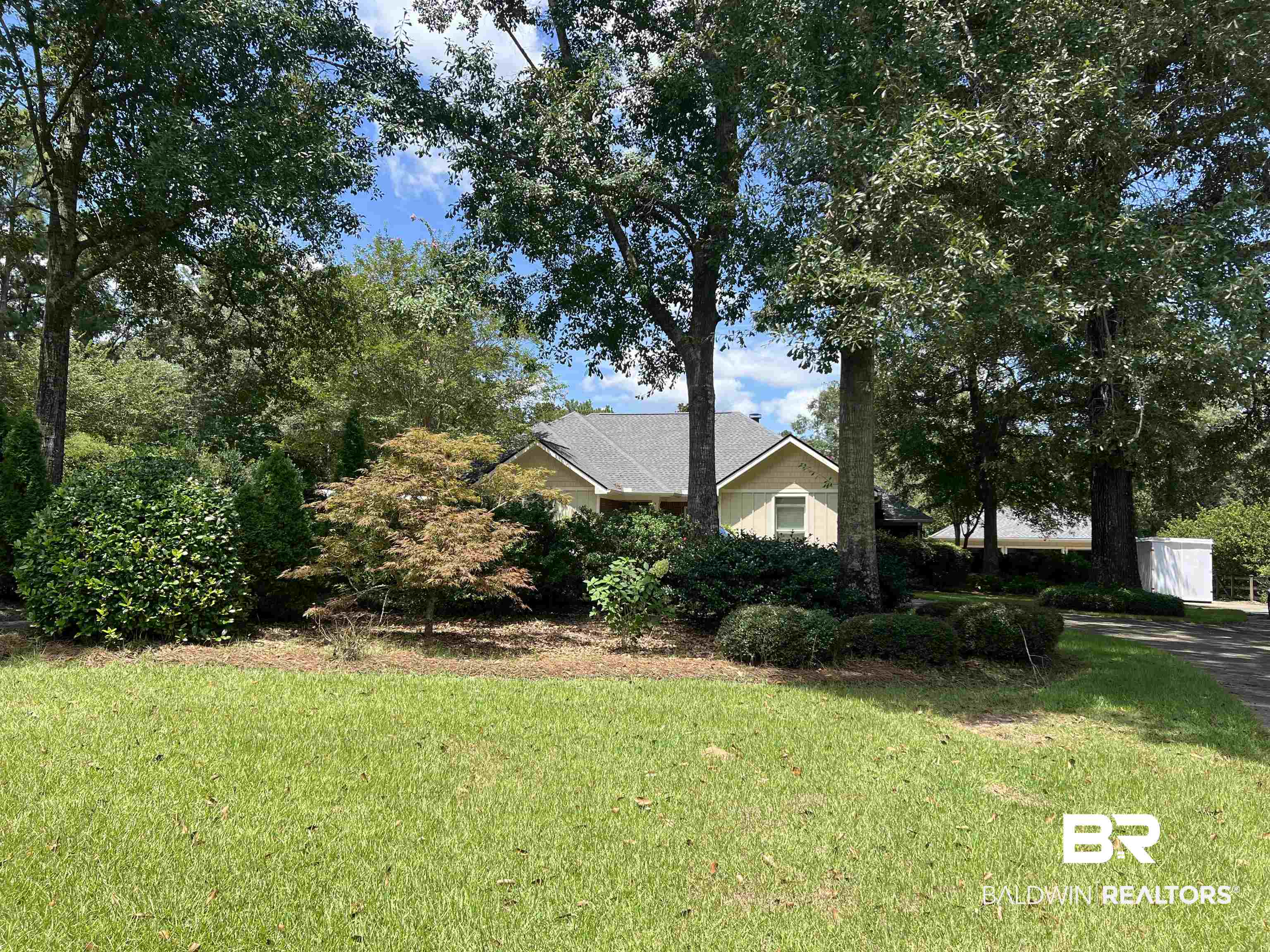 10721 Redfern Road Daphne, AL 36526 - Photo 1 of 7 View of home's exterior featuring a lawn