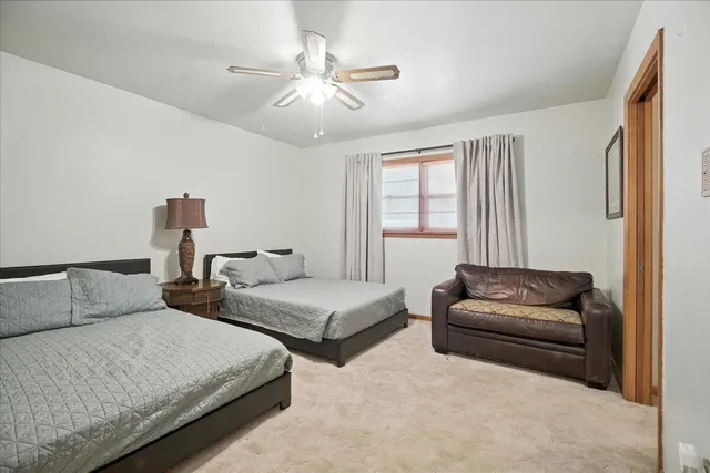 a bathroom with a sink a window and shower