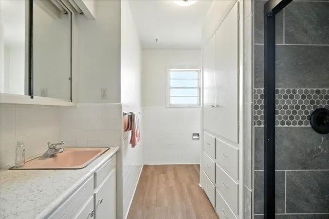 a swimming pool with an outdoor space and seating area