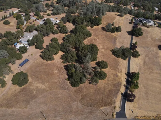 an aerial view of residential house with parking space