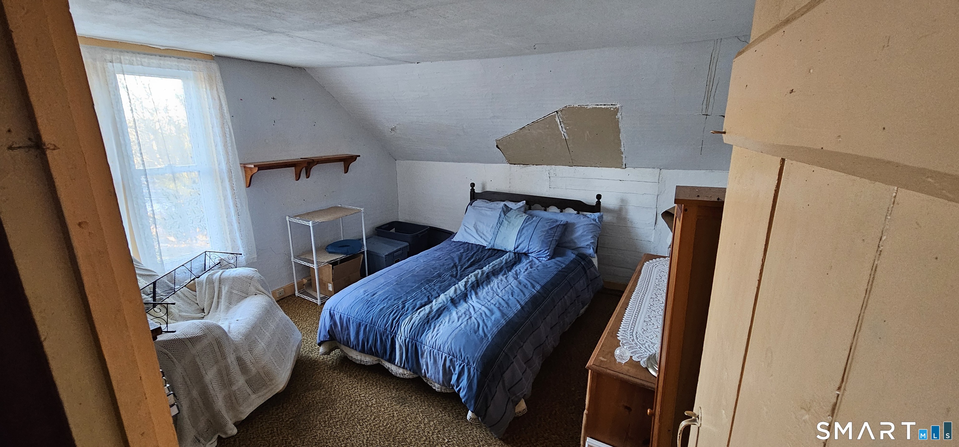 933 Hampton Road Pomfret, CT 06259 - Photo 14 of 16 a bedroom with furniture and a window