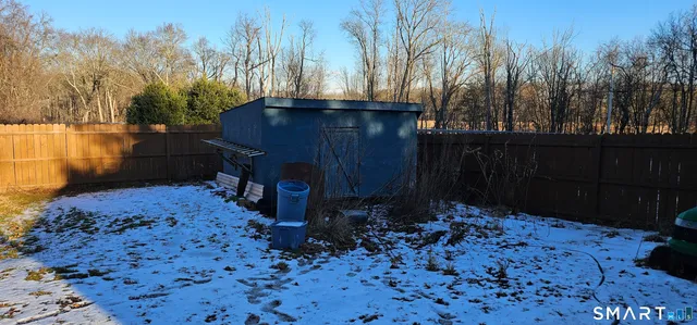 a view of a backyard of the house