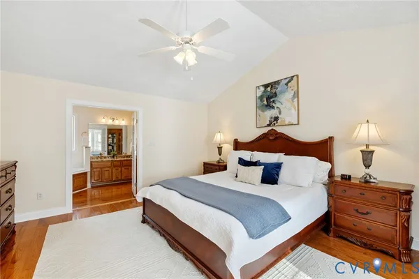 a bedroom with a bed and cabinet