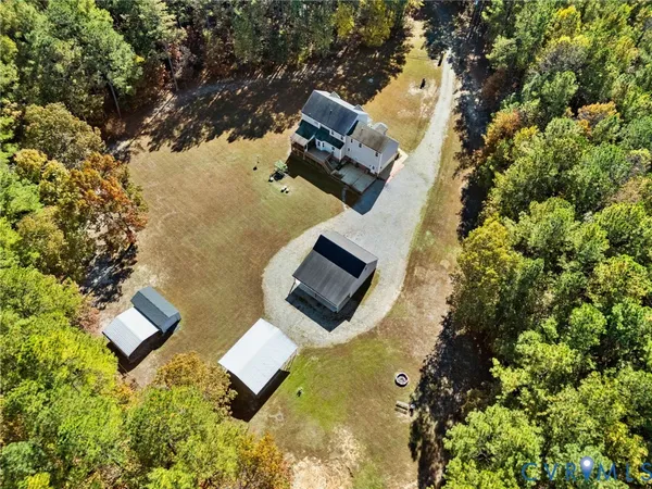 an aerial view of house with yard swimming pool and outdoor seating
